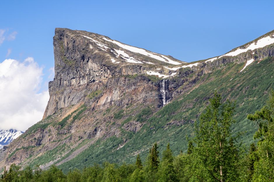 Stunning view of a rocky mountain with a waterfall in Norrbottens län, Sweden.
